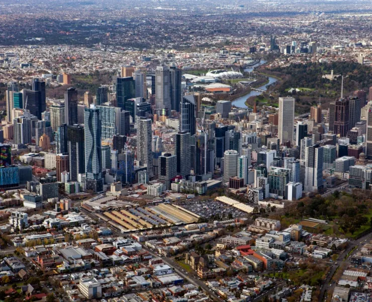 Aerial shot of Melbourne city skyline focusing on Queen Victoria market